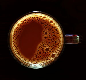 Close-up of coffee cup against black background