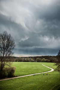 Scenic view of landscape against cloudy sky