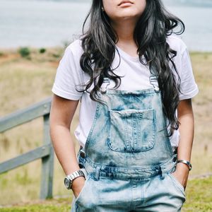 Midsection of woman with hands in pockets