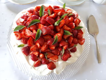 High angle view of strawberries in plate on table