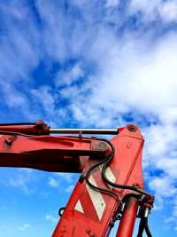 Low angle view of rollercoaster against sky in city