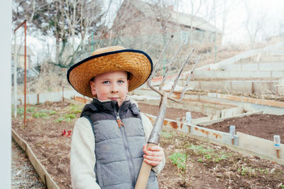 Full length portrait of boy standing outdoors