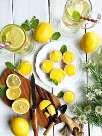 High angle view of drinks with fruits on table