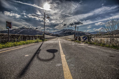 Empty road against sky