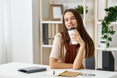 Businesswoman using laptop at home