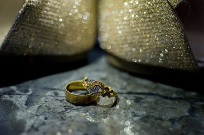 Close-up of wedding rings on table