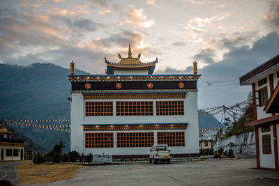 Temple building against sky in city