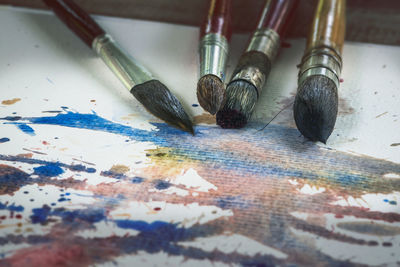 High angle view of paintbrushes on table