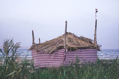 Built structure on field against clear sky