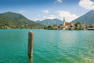 Scenic view of sea and mountains against sky