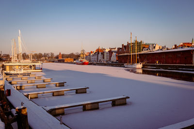 View of bridge over river against buildings in city