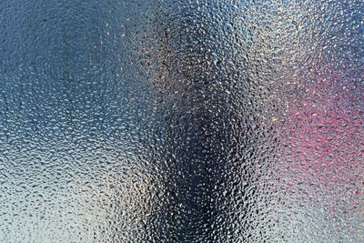 Close-up of water drops on glass