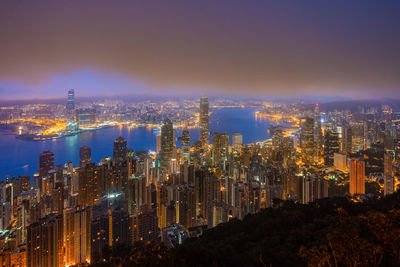 Illuminated buildings in city at night