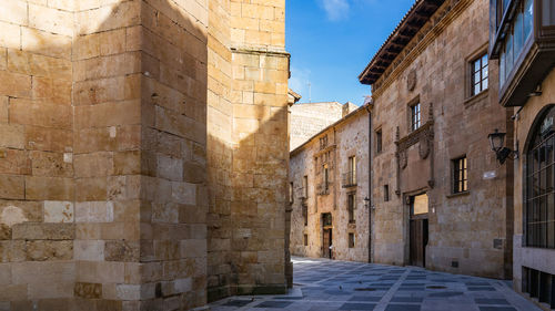 Alley amidst buildings in city