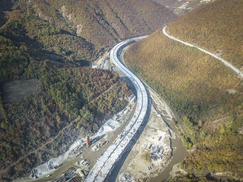 High angle view of winding road on land