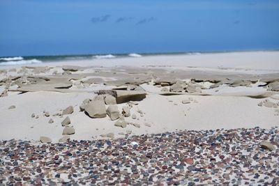 Surface level of beach against sky