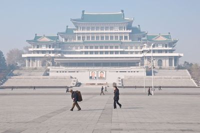 People on historical building