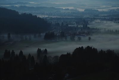 High angle view of silhouette landscape against sky