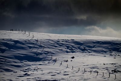 Snow landscape against dramatic sky