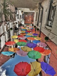 High angle view of multi colored umbrellas on building