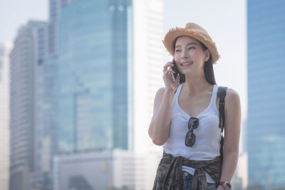 Beautiful young woman using smart phone