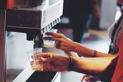 Close-up of hand holding coffee cup