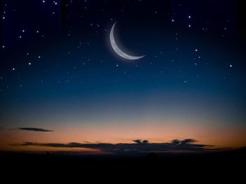 Scenic view of moon against sky at night