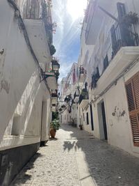 Street amidst buildings against sky