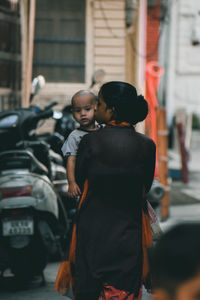 Mother kissing the baby