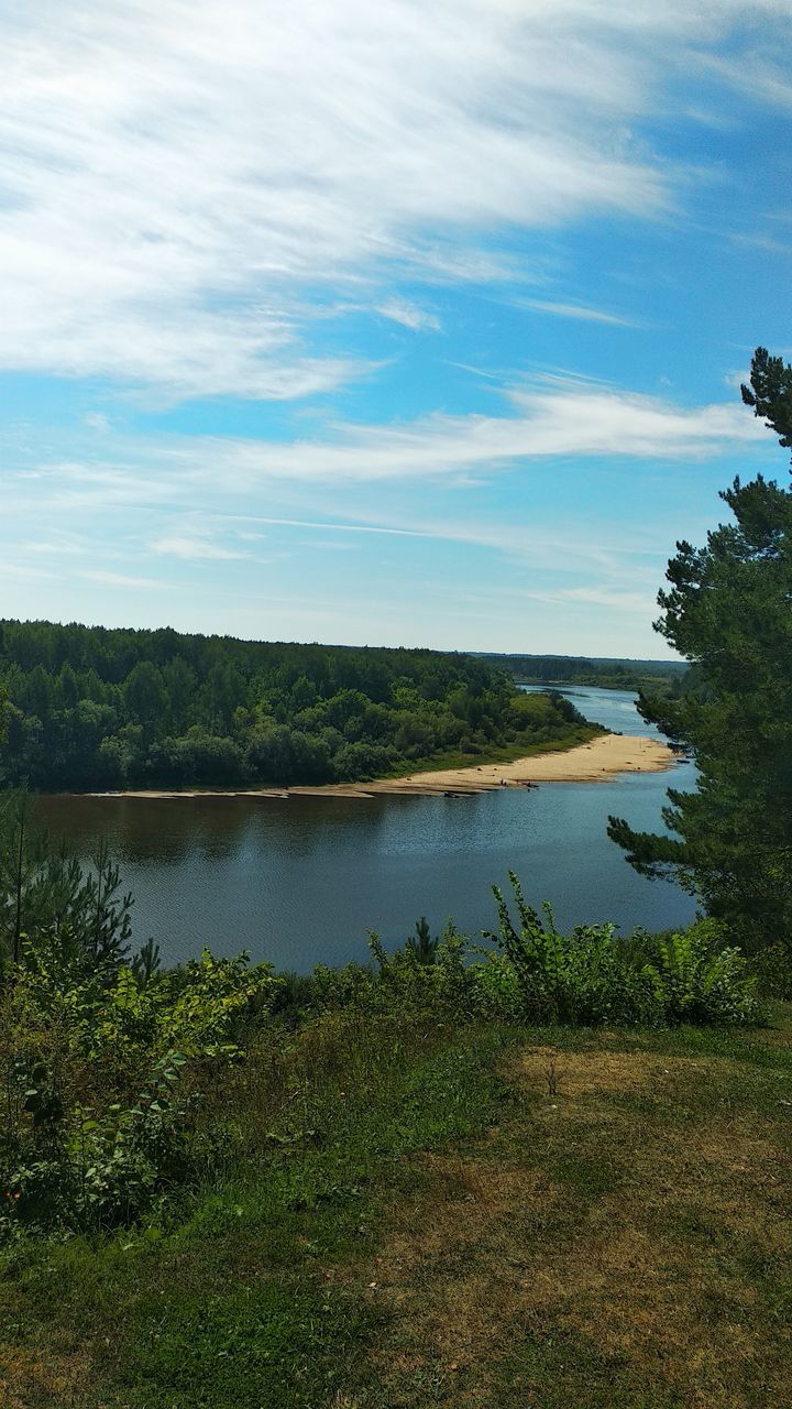 water, plant, sky, nature, scenics - nature, beauty in nature, tree, cloud, tranquility, tranquil scene, reflection, no people, lake, land, reservoir, environment, shore, body of water, non-urban scene, hill, landscape, grass, coast, day, green, outdoors, beach, natural environment, growth, idyllic, wetland, travel destinations, rural area, wilderness, horizon, travel