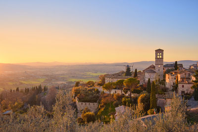 View of townscape against clear sky during sunset