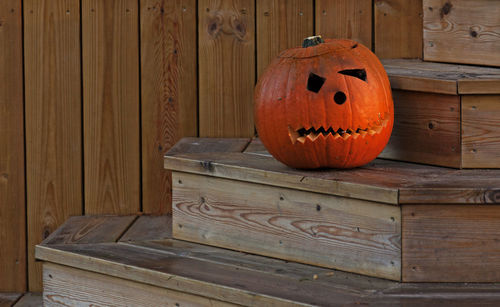 View of pumpkin on wooden wall during halloween