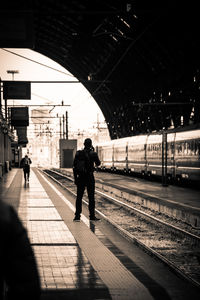 People waiting at railroad station platform