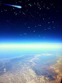 Aerial view of lake against sky at night