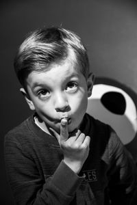 Portrait of boy holding camera