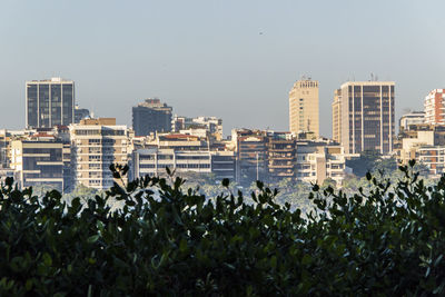 Buildings against clear sky