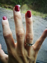 Midsection of woman with red hand