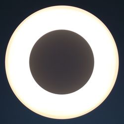 Low angle view of illuminated lights at night