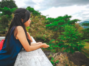 Side view of teenage girl at observation point