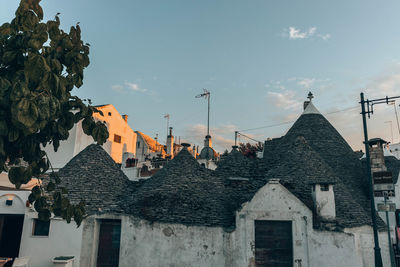 Panoramic view of houses and buildings against sky