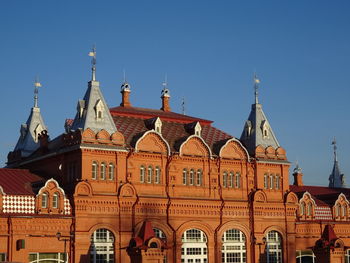 View of buildings against blue sky
