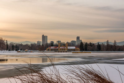 View of city during winter at sunset
