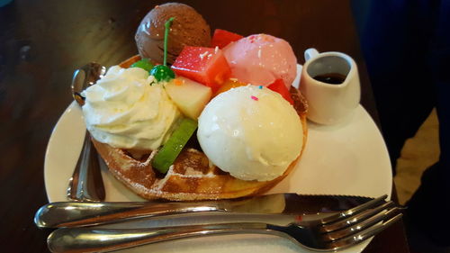 Close-up of ice cream served on table