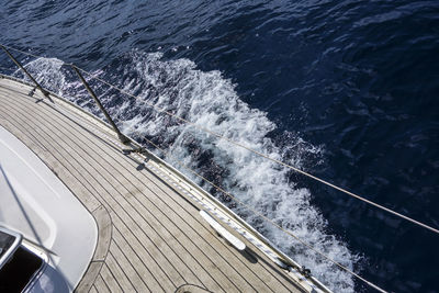 Cropped image of boat sailing in sea