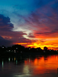 Scenic view of lake against romantic sky at sunset