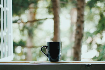 Close-up of coffee cup on table