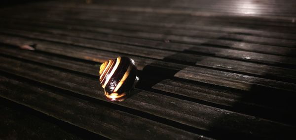 High angle view of ring on wooden table