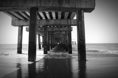 Pier over sea against sky