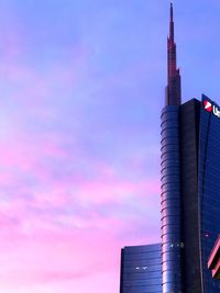 Low angle view of buildings against sky during sunset