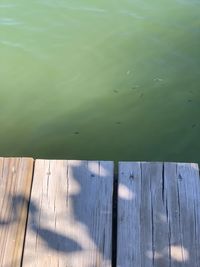 High angle view of wooden pier over lake